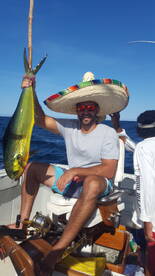 The sombrero man bags a nice dorado!