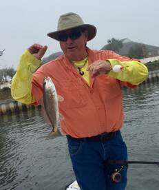 man hold redfish Navarre 