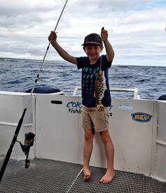 Young angler reeling them in!