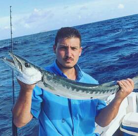 Live bait trolling, a nice cuda!