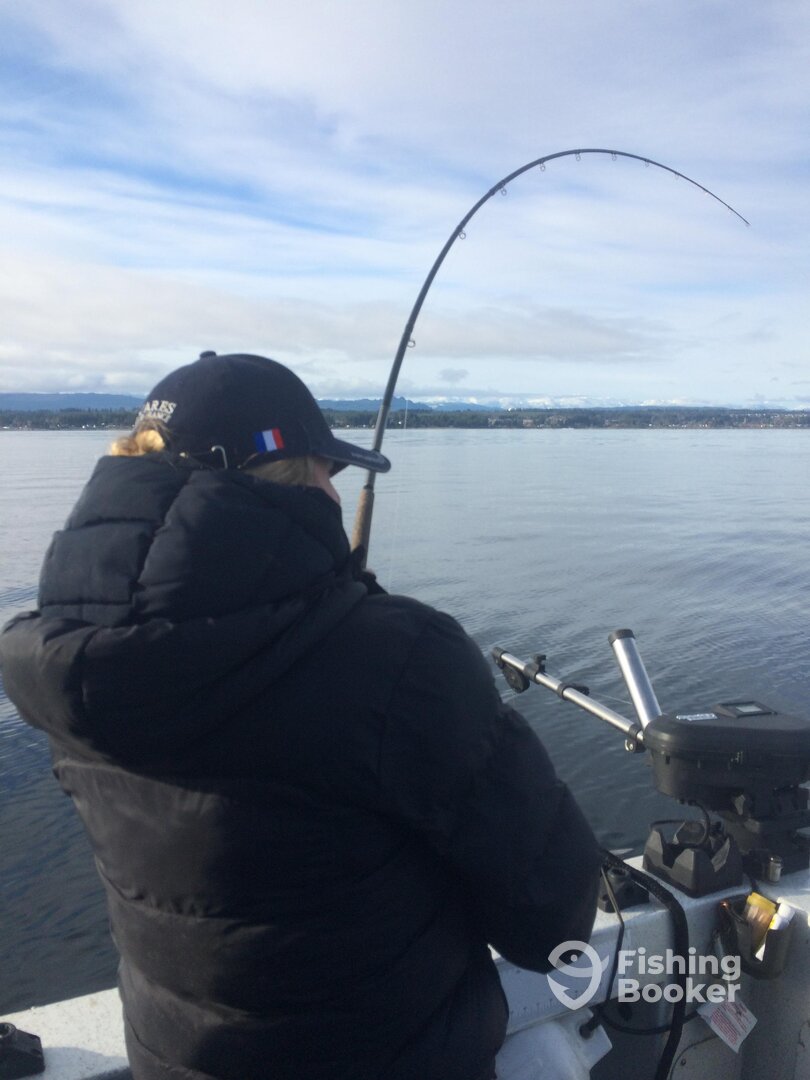 Fighting a fish on a Flat calm winter day 