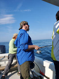 Joel, Doug, and Zeb trying to entice a bite.