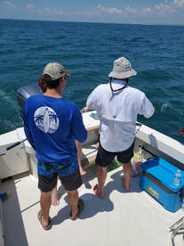 Captain Phillip and Austin working on a king.