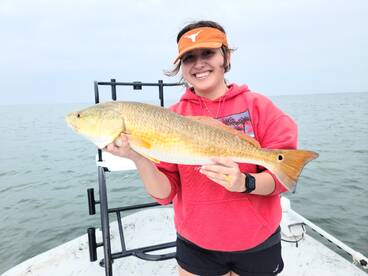Beautiful young angler with big Red drum. 