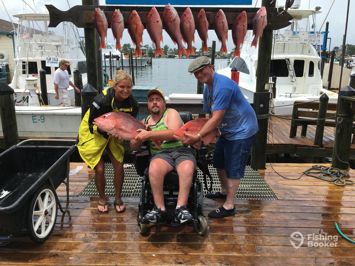 Mandy our first mate helping Ryan show off his prize fish!