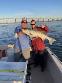 Olivia with a 35” slot keeper striped bass