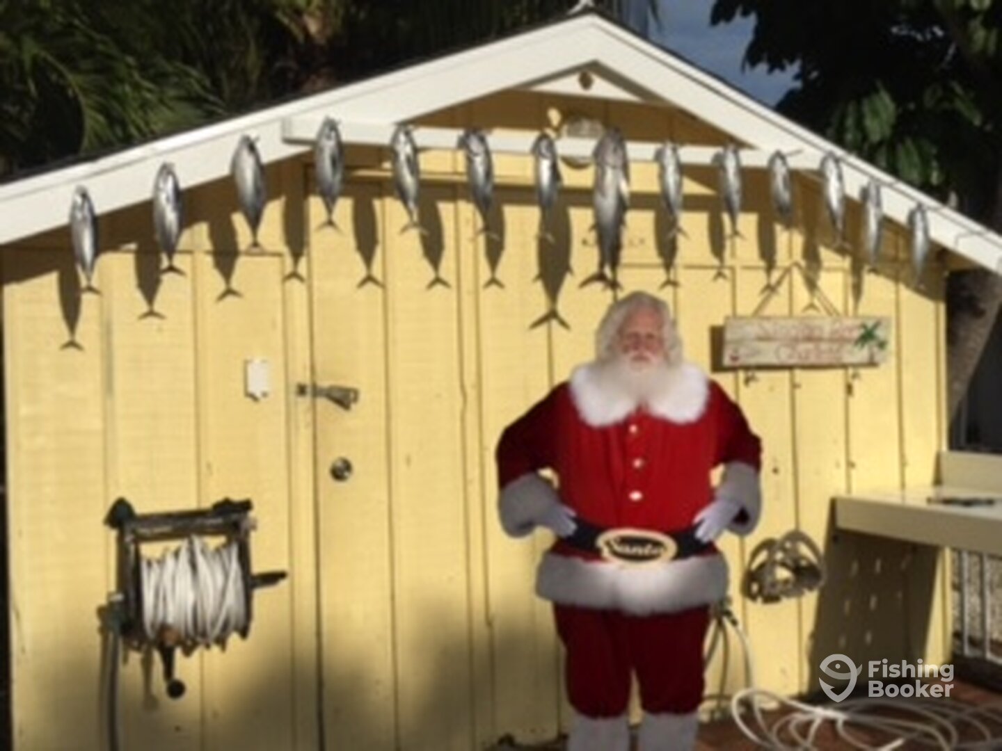 Santa took a break from checking the list to Tuna Fish with the Singing Reel in Paradise