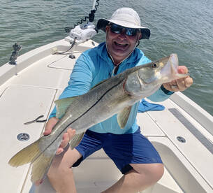 Catching his biggest snook ever!!