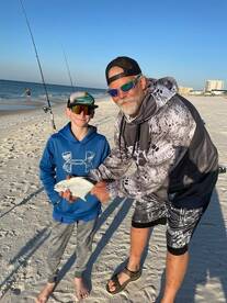 Young man gets 2 nice pompano's