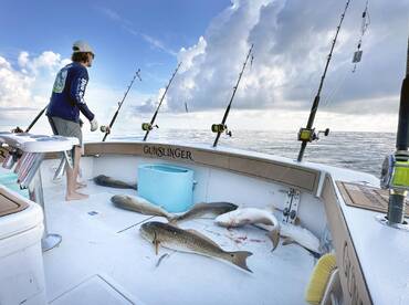 The red drum are biting, and red snapper