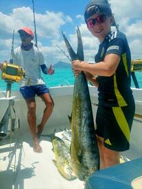 The young man caught his first doradoes 