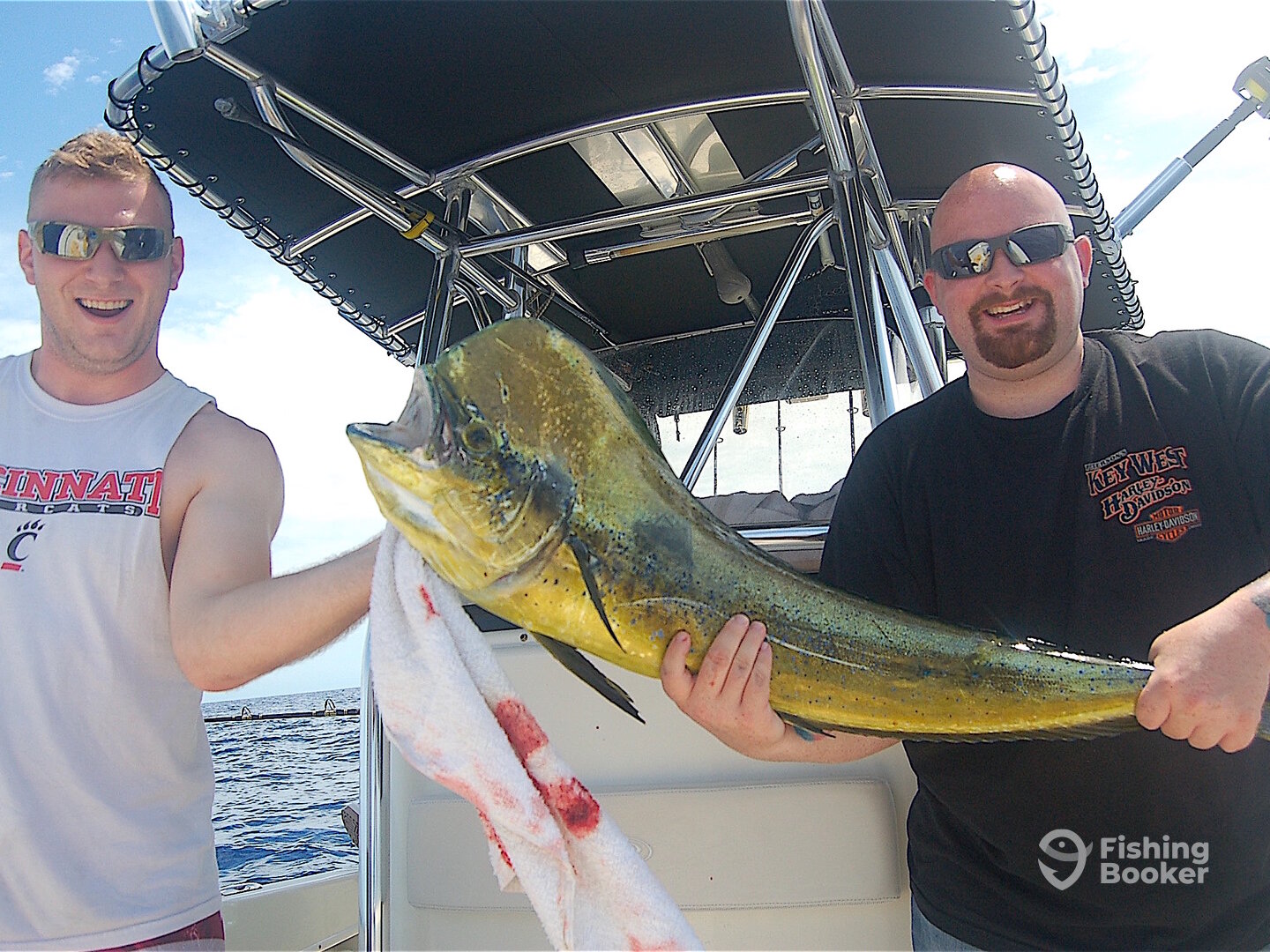 Josh, left, caught this 37-inch bull dolphin that hit a lure trolled along some rips about 15 miles off Palm Beach on Father's Day,.