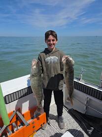 Father  son  catching  trophies 