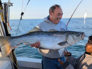Kids first trophy striper !!!!